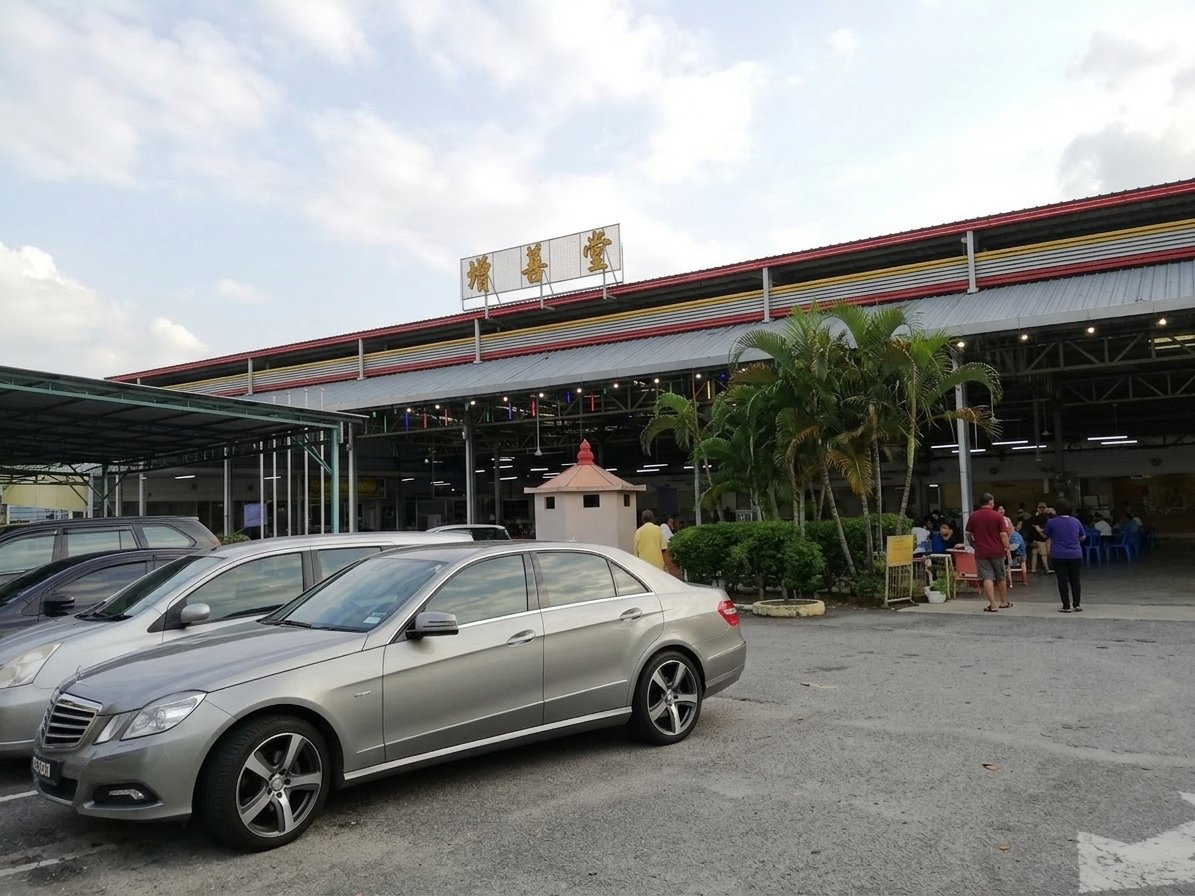 Exterior view of Jin Jang hall parking lot with cars.
