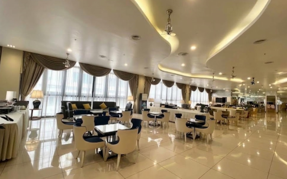 Modern indoor wake hall setup at Nirvana Funeral Hall, Kuala Lumpur, with elegant seating and lighting.